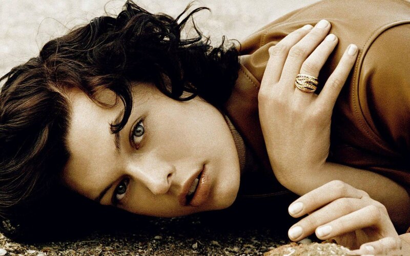 woman with curly hair lying down