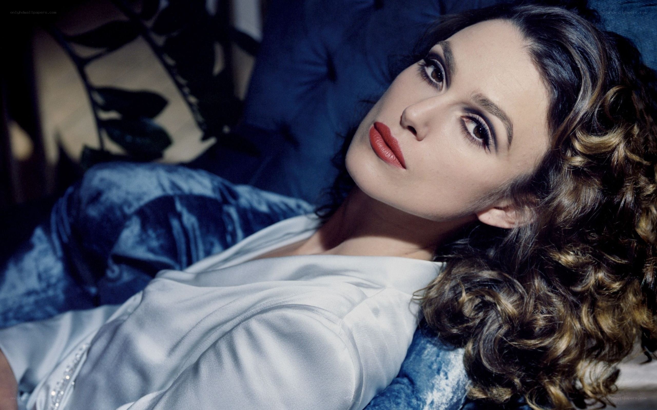 woman with curly hair lying down