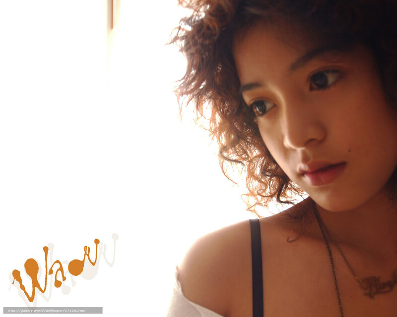 woman with curly hair near window