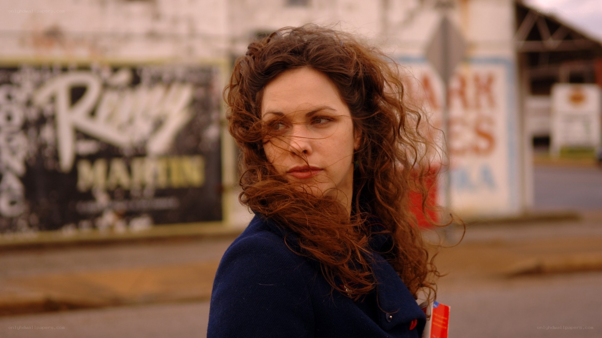 woman with curly hair on street
