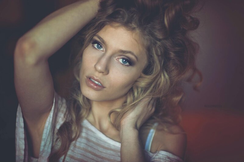 woman with curly hair posing