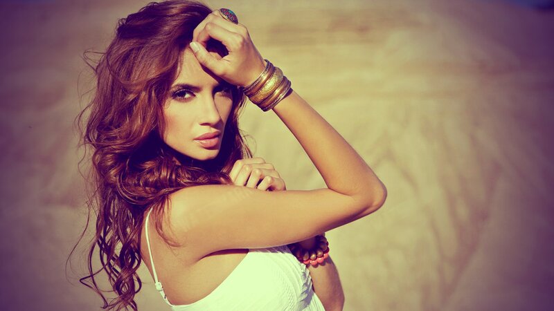 woman with curly hair posing