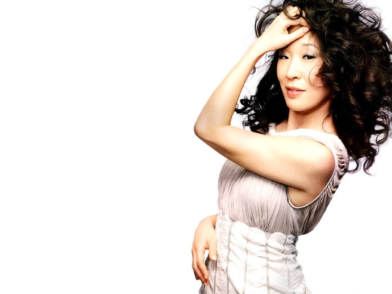 woman with curly hair posing