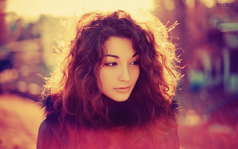 Woman with Curly Hair — Red, Dramatic, Sunset, Photograph, Coat, Sunlight