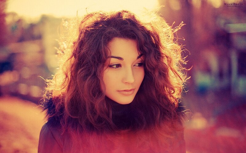 Woman with Curly Hair — Red, Dramatic, Sunset, Photograph, Coat