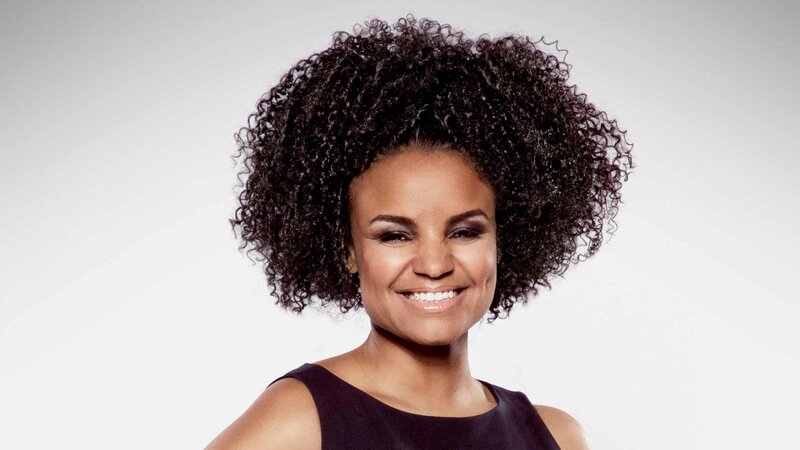 woman with curly hair smiling