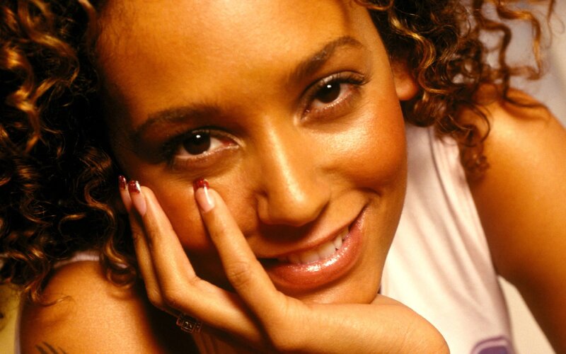 woman with curly hair smiling