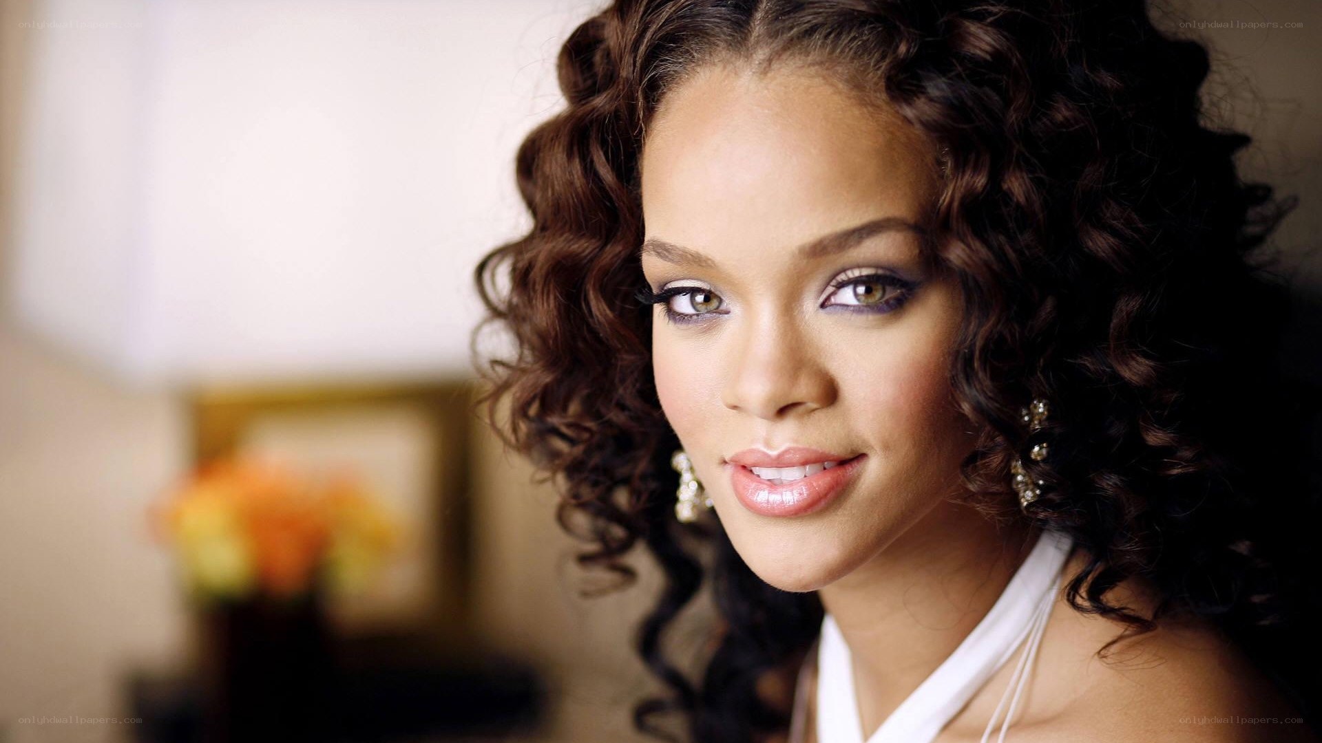 woman with curly hair smiling