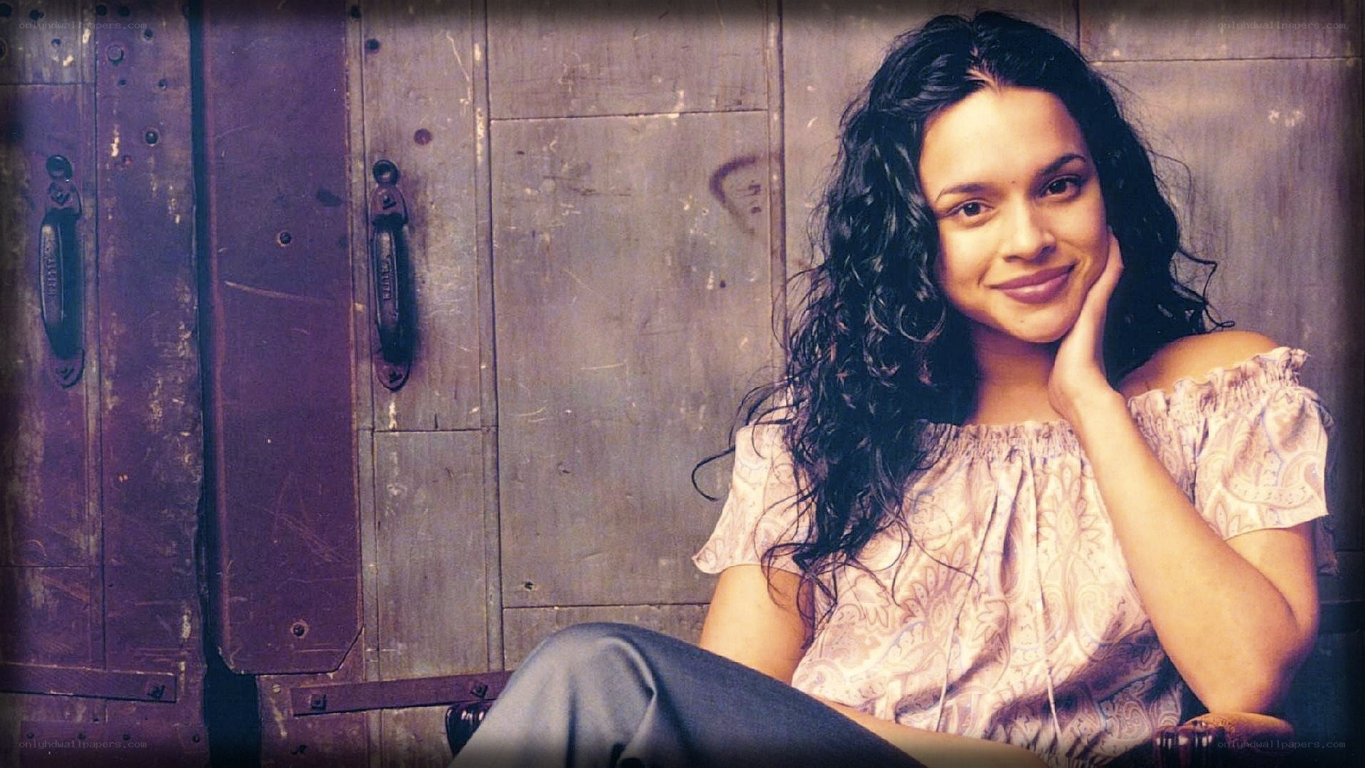 woman with curly hair smiling
