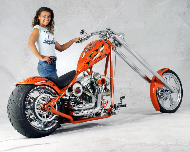 Woman with custom chopper motorcycle