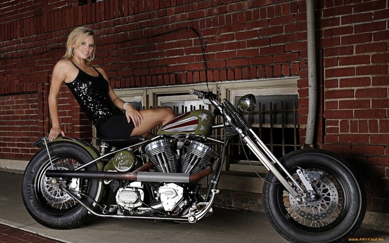 Woman with custom chopper motorcycle