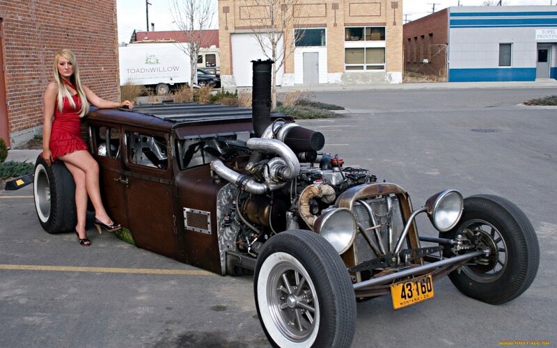 Woman with custom hot rod car