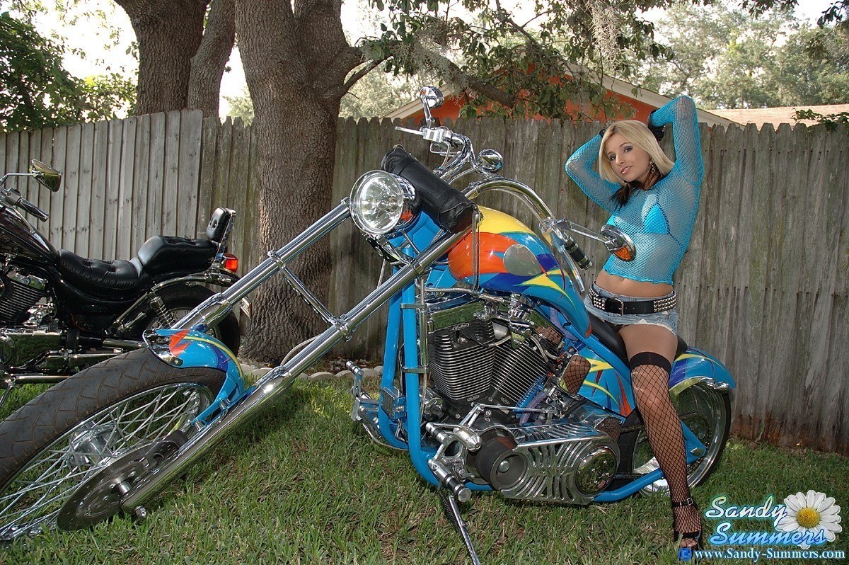 Woman with custom motorcycle