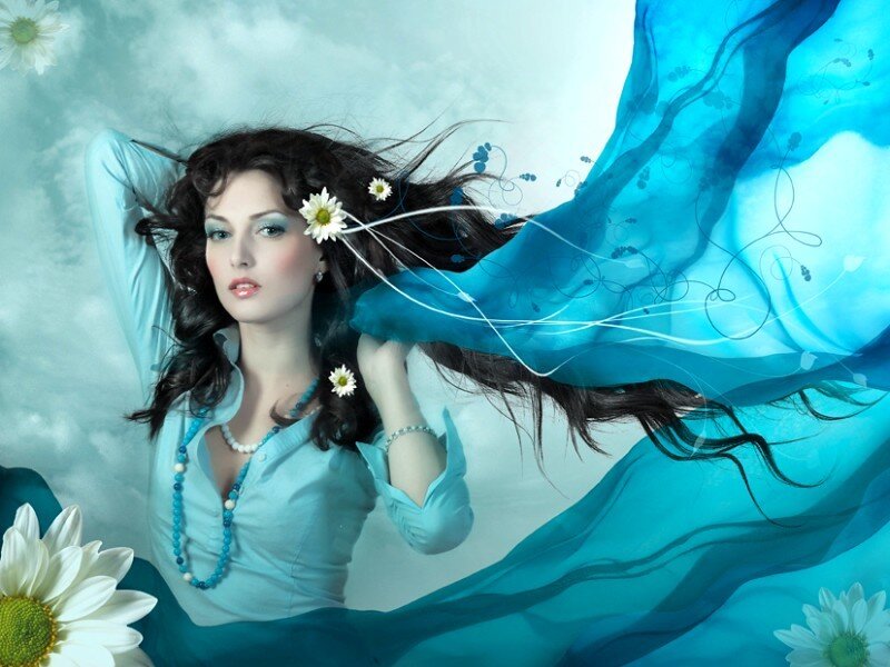 woman with daisies and blue fabric