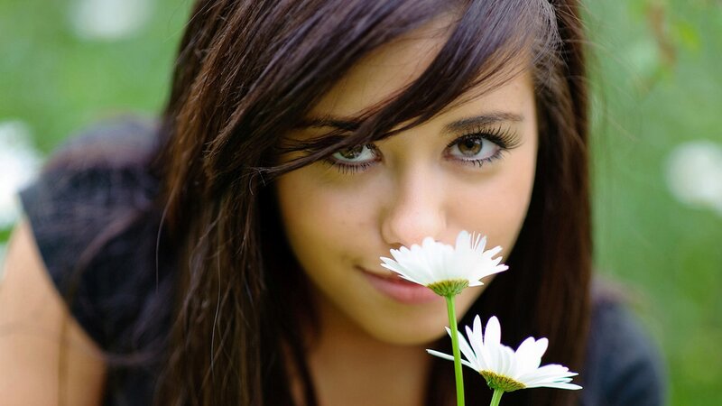woman with daisies in garden