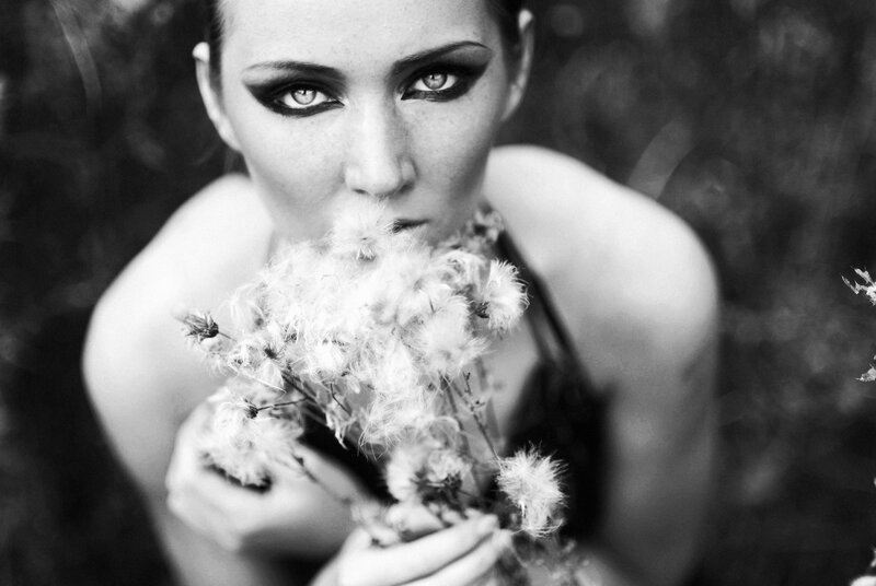 woman with dandelion seeds