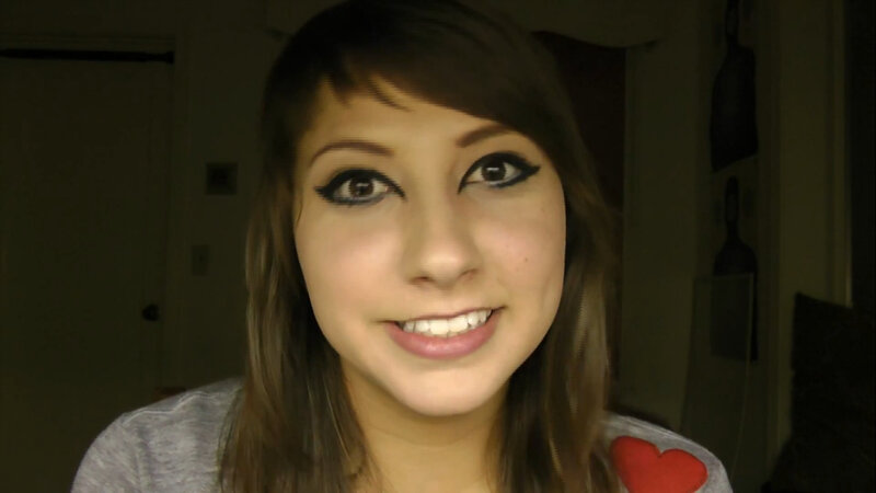 woman with dark eye makeup