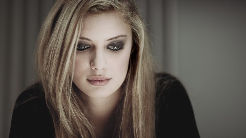 woman with dark eye makeup