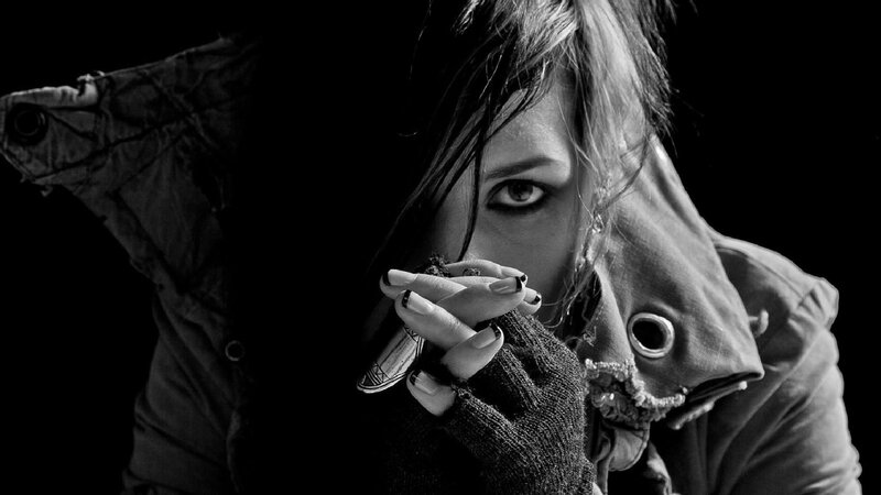 woman with dark eye makeup