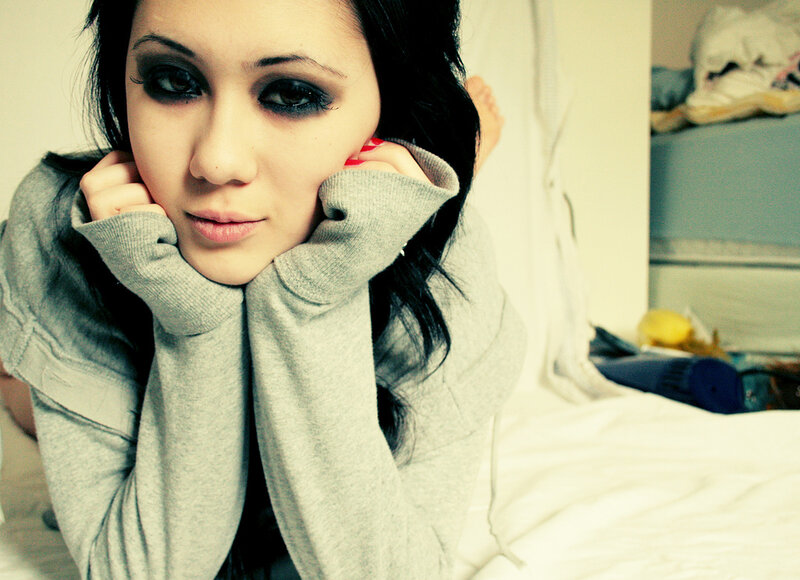 woman with dark eye makeup