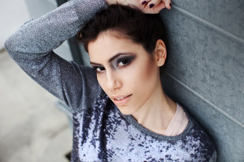 woman with dark eye makeup