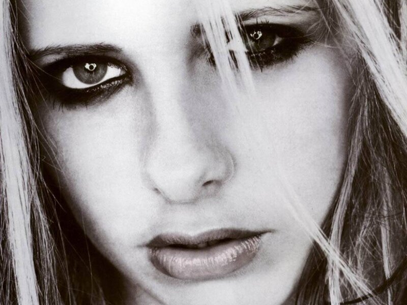 Woman with Dark Eye Makeup — Black