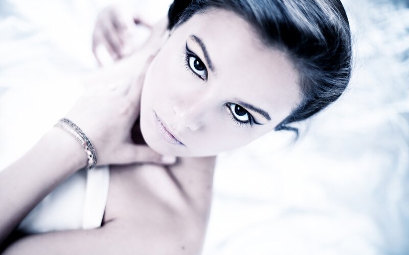 woman with dark eyes looking up