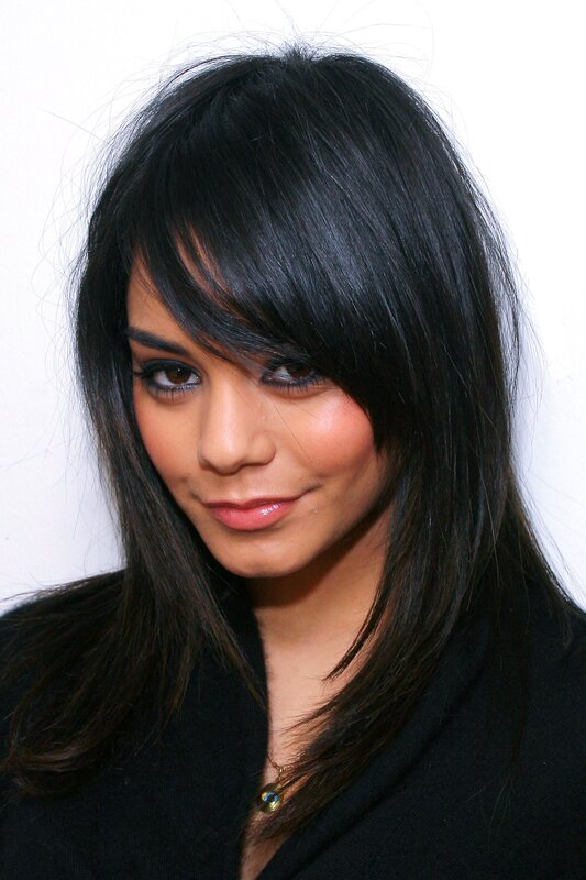 woman with dark hair and bangs