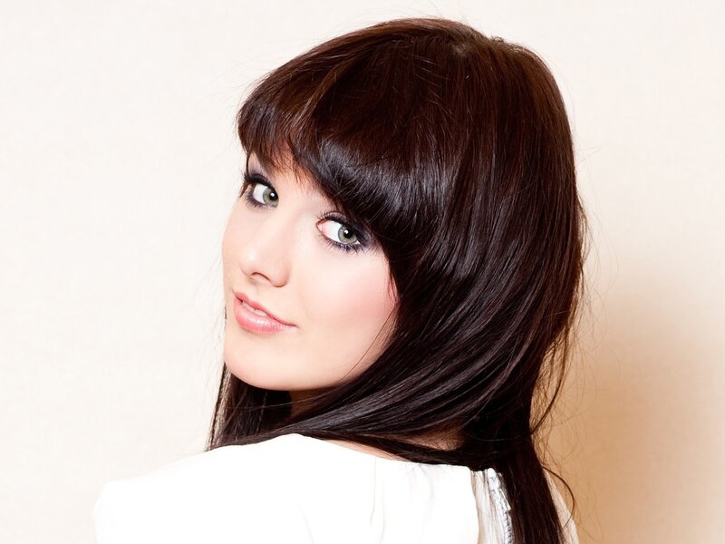 woman with dark hair and bangs