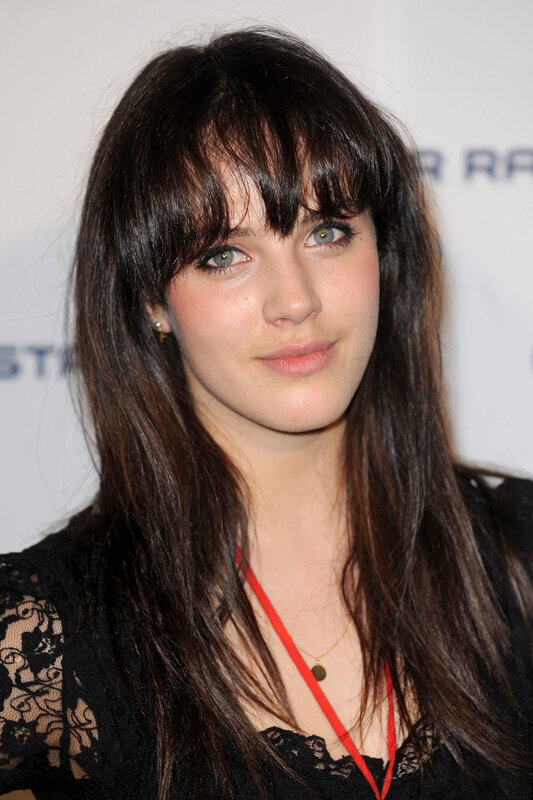woman with dark hair and bangs