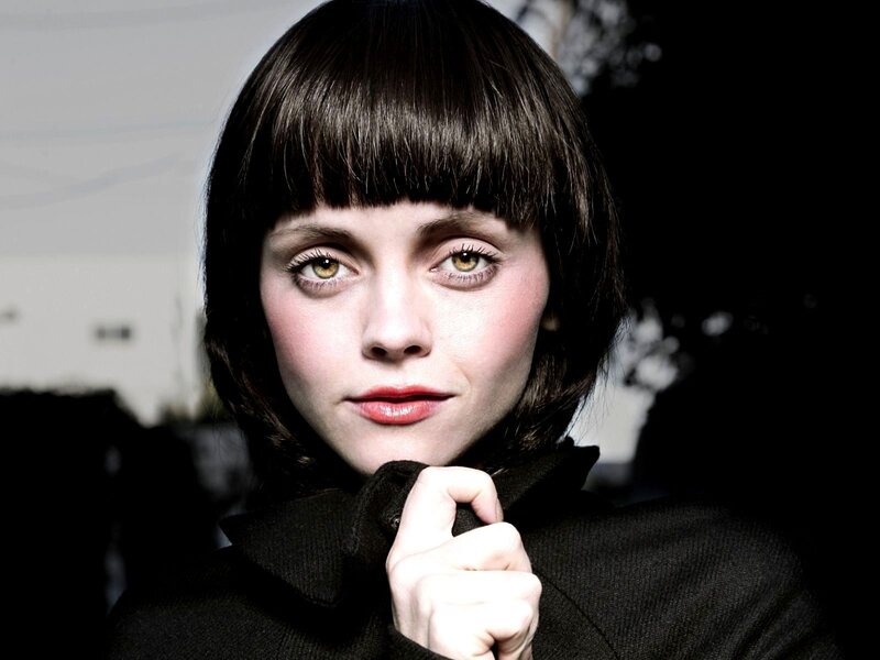 woman with dark hair and bangs