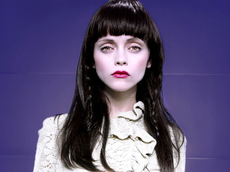 woman with dark hair and bangs