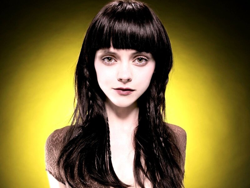 woman with dark hair and bangs