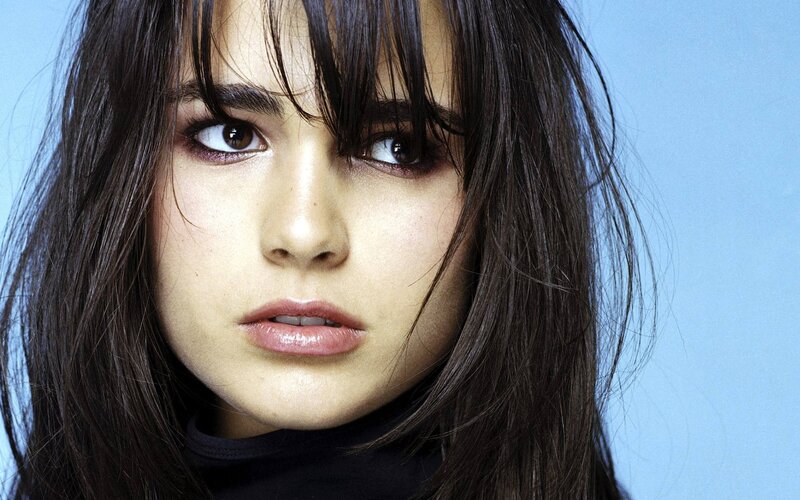 woman with dark hair and bangs
