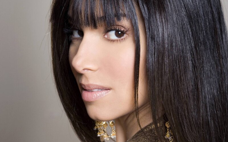 woman with dark hair and bangs