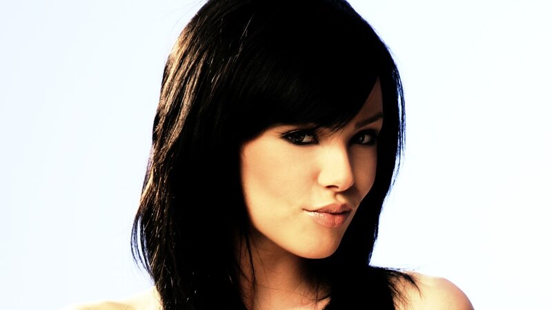 woman with dark hair and bangs