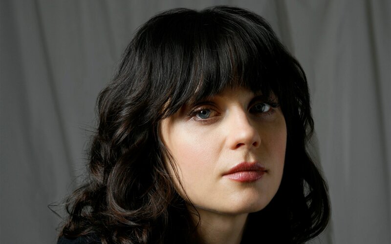 woman with dark hair and bangs