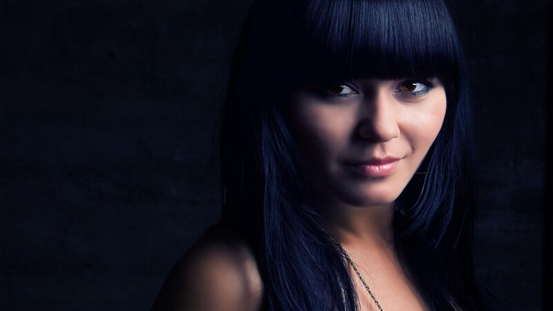 woman with dark hair and bangs