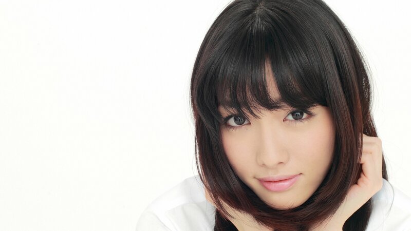 woman with dark hair and bangs