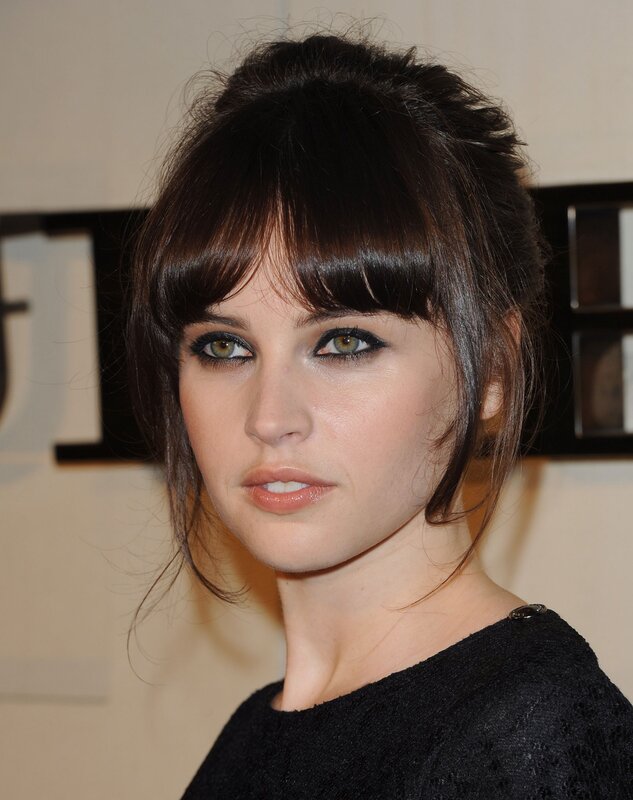 woman with dark hair and bangs