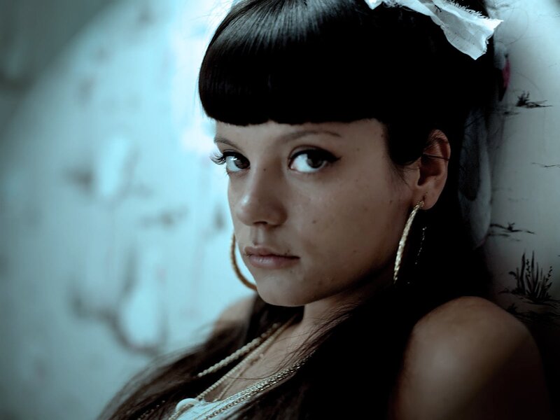woman with dark hair and bangs