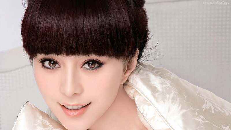 woman with dark hair and bangs