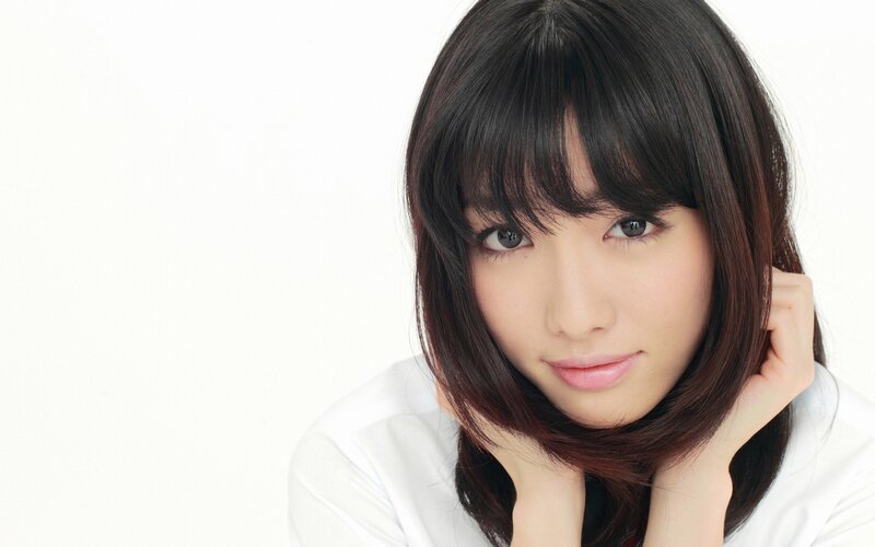 woman with dark hair and bangs