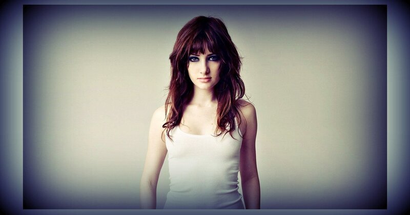 woman with dark hair and bangs