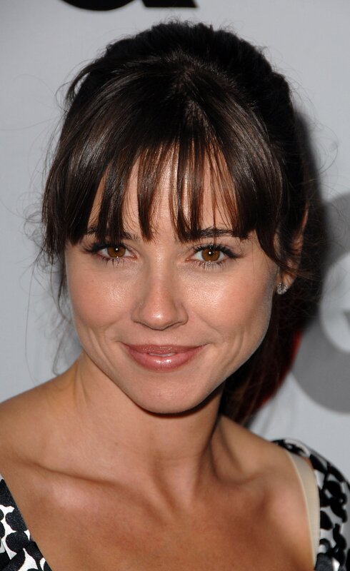 woman with dark hair and bangs
