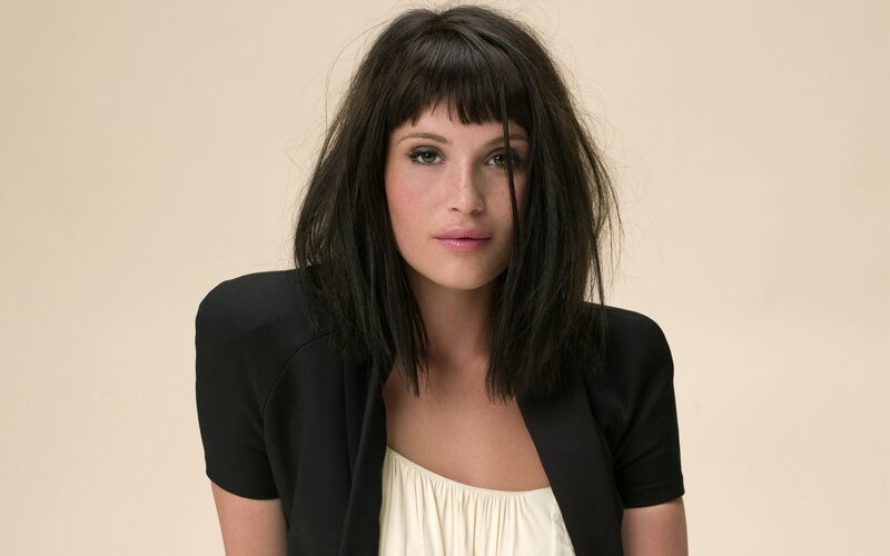 woman with dark hair and bangs