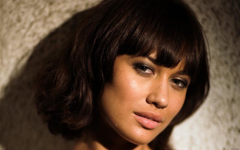 woman with dark hair and bangs