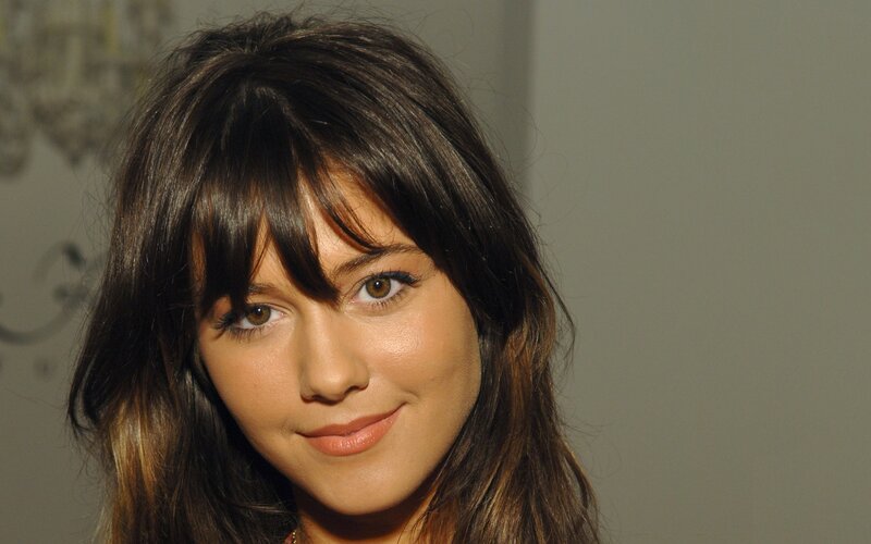 woman with dark hair and bangs