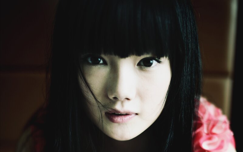 woman with dark hair and bangs