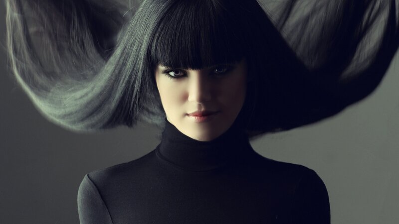 woman with dark hair and bangs